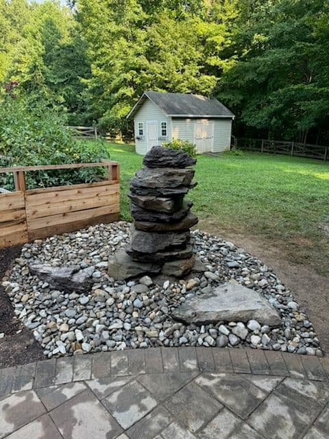 Tranquil Backyard Oasis with New Stone Fountain image